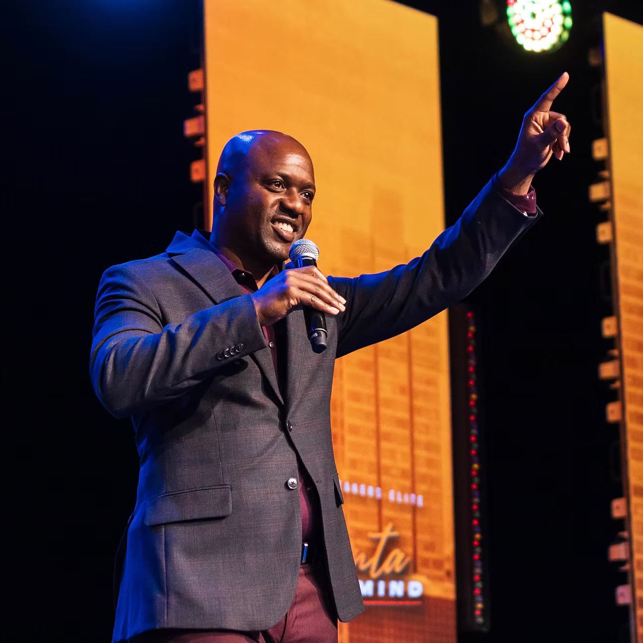 Neco Johnson speaking on stage